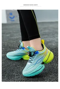 Detailed view of boys' lightweight blue and green running shoes with rotary buckle
