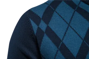 Close-up detail of a men's navy blue knitted sweater featuring a teal argyle pattern.