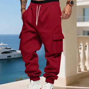 Detailed view of red fleece cargo sweatpants with flap pockets and drawstring
