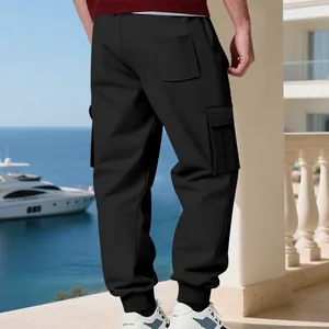 Back view of men's black cargo sweatpants with fleece lining and flap pockets.