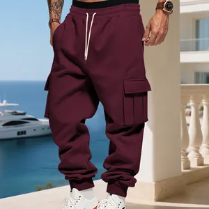 Detail view of men's fleece-lined maroon cargo pants with multiple utility pockets