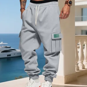 Men's heavy fleece cargo joggers with multi-pocket design shown in a casual outdoor setting