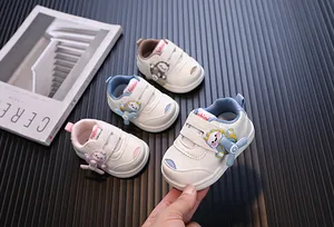 Close-up of baby walking shoes with a cute rotatable cartoon propeller detail.