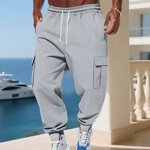 Detail view of men's gray fleece cargo sweatpants with drawstring and side pockets