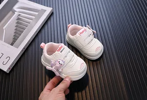Detailed view of white cartoon toddler walking shoes with rotating fan accessory