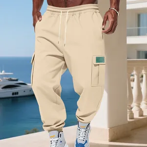 Close-up of men's beige fleece cargo sweatpants featuring side pockets and a relaxed fit