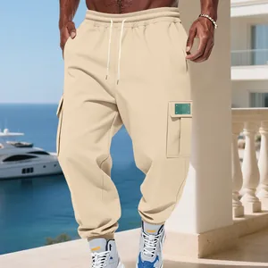 Detail view of men's khaki heavyweight fleece cargo sweatpants with drawstring waist