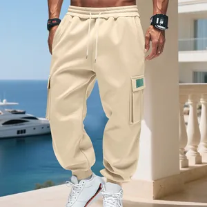 Detail view of men's heavy fleece cargo sweatpants with drawstring waist and pockets