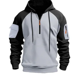 Men's two-tone half-zip hoodie with utility arm pocket and orange zipper details