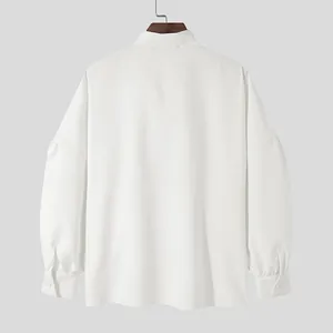 Detailed back view of white drop-shoulder loose long-sleeve shirt with a high collar