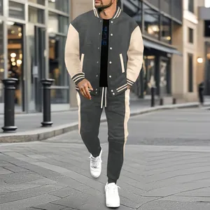 Men's urban streetwear grey and beige color-block varsity jacket and joggers set.
