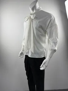 Detailed side view of white men's drop-shoulder loose shirt with large bow tie design.