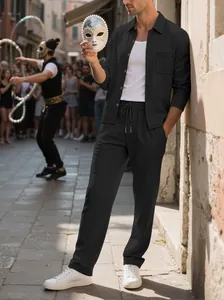 Men's black corduroy two-piece set with a long-sleeve shirt and matching pants outdoors