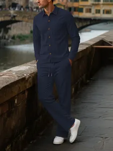 Men's navy corduroy long sleeve button-up shirt and pants casual two-piece outfit set.
