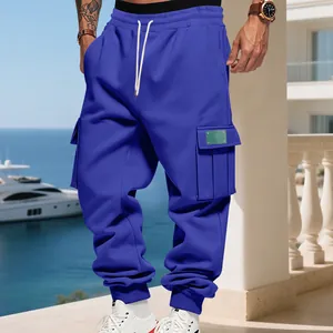 Close-up of blue cargo joggers showing the heavy fleece texture and pocket detail