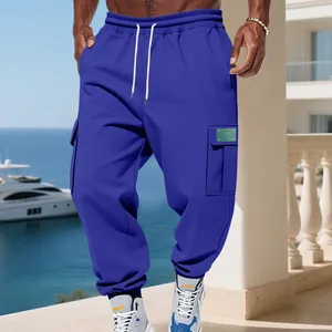 Detailed view of blue men's heavy fleece cargo sweatpants with drawstring waist and pockets