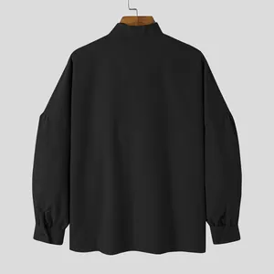 Back view of minimalist men's loose-fit long sleeve shirt with drop shoulder black