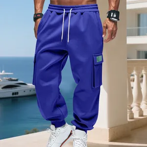 Detailed view of men's blue cargo sweatpants with large side pockets and drawstring