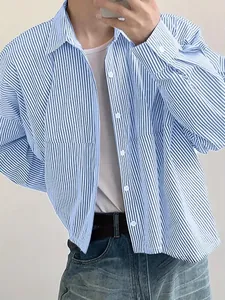 Detailed view of men's loose vertical stripe long-sleeved shirt in blue and white colors