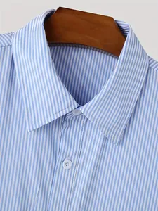 Close-up of blue and white vertical striped men's shirt collar with white buttons.