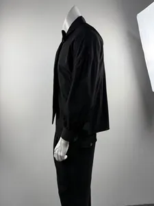 Detailed side view of a black drop shoulder long sleeve shirt with tie for men