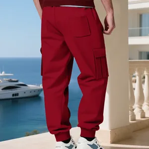 Detailed back view of red men's cargo sweatpants showing side pockets and cuffed hem
