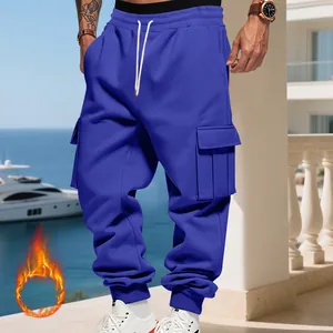 Close-up of royal blue men's heavy fleece-lined cargo sweatpants with multi-pockets