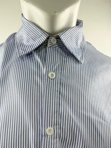 Detail view of the buttoned collar on a blue and white vertical striped men's shirt