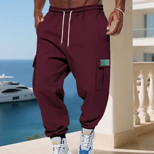 Men's heavyweight fleece-lined burgundy cargo sweatpants with multi-pockets for casual sports wear.