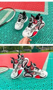 Breathable mesh children basketball shoes with innovative knob buckle and red accents.