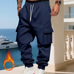 Detail of navy blue heavy fleece-lined men's cargo pants in loose sports style