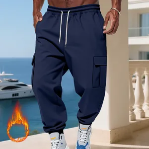 Detail view of men's heavyweight fleece cargo pants with multi-pockets in navy blue