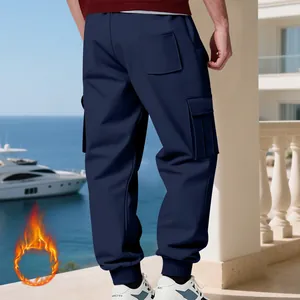 Back view of men's navy blue heavy fleece-lined cargo pants featuring multi-pockets