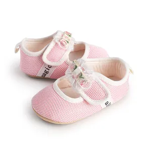 Detail view of breathable pink baby girl mesh princess shoes with decorative floral bow