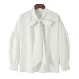 Stylish white long-sleeve shirt featuring drop shoulder and loose tie neck design