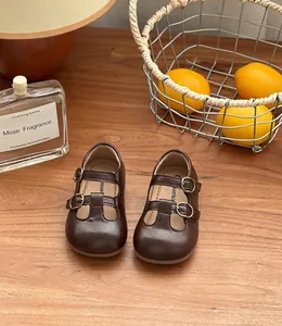 Detailed view of girls' retro dark brown T-strap Mary Jane leather shoes for toddlers
