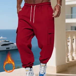 Close-up detail of heavy fleece-lined red cargo pants for men with multiple large pockets