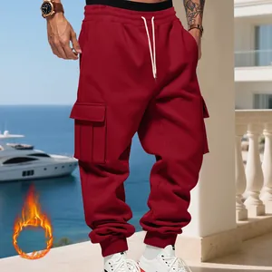 Detailed view of red heavyweight fleece-lined men's cargo pants with large side pockets
