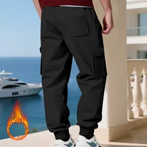 Men's heavy black fleece-lined cargo pants with multi-pockets and jogger cuffs style.