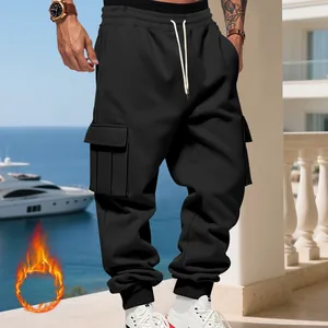 Detailed view of men's black fleece-lined cargo pants with large utility side pockets.