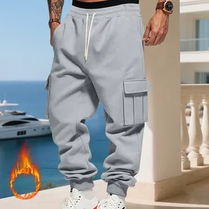 Detailed view of heavy fleece grey cargo joggers for men featuring functional side pockets.
