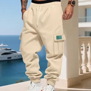 Outdoor lifestyle view of heavy-duty beige men's cargo sweatpants with side pockets