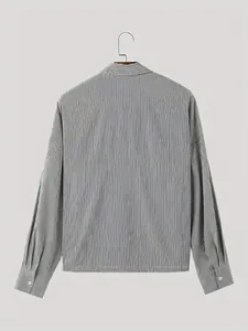 Back view of a grey and white vertical striped long-sleeved shirt on a wooden hanger