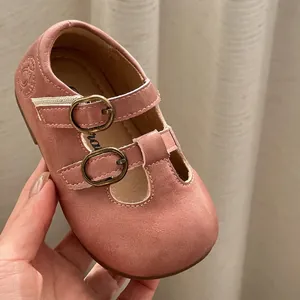 Elegant vintage pink leather Mary Jane shoes for toddler girls with double buckles.