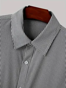 Close-up detail of men's vertical striped long-sleeved shirt with classic collar