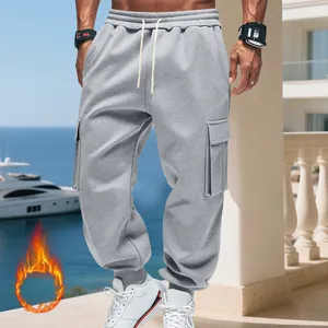 Close-up detail of grey fleece-lined cargo sweatpants for men with drawstring waist