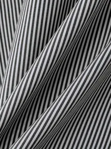 Detailed macro view of black and white vertical striped fabric texture for men's shirts