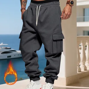 Close-up of dark grey heavyweight fleece-lined cargo joggers with drawstring waist