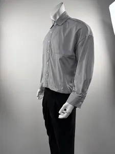 Detailed side profile of a men's loose vertical striped long-sleeved shirt on mannequin