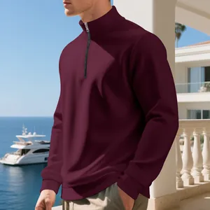 Detailed view of men's maroon half-zip sweatshirt featuring a warm fleece lining